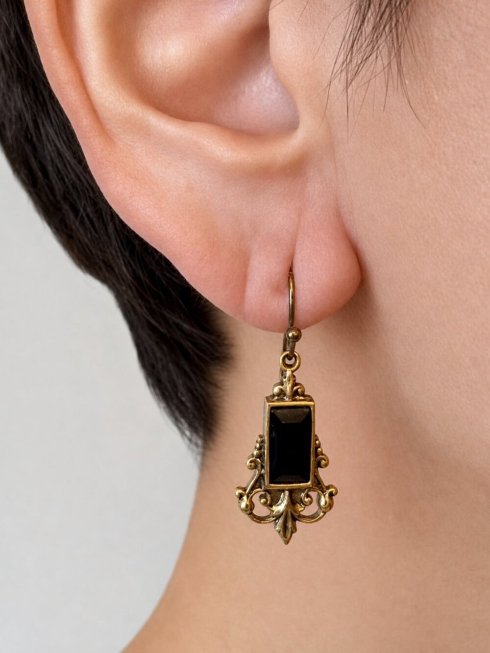 1928 Gold Tone Victorian Earrings with Black Faceted Stone